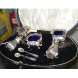 A cased silver condiment set