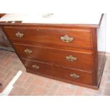 An antique chest of three long drawers