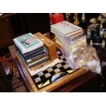 A selection of chess related books, stop clock etc