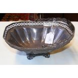 A silver basket with pierced rim and swing handle,