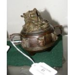 A bronze two handled pot and cover
