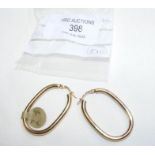 A pair of new 9ct gold large oval hoop earrings