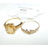 A smoky quartz style dress ring in gold setting to