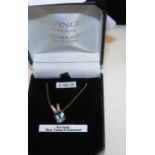 A new 9ct gold blue topaz and diamond pendant on 9