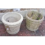 A pair of cast stoneware garden urns with rope twi