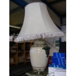 A baluster ceramic table lamp and shade