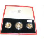 A Royal Mint three piece gold coin set - 1986 £2,
