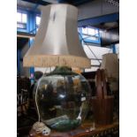 A glass carboy table lamp