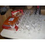 An assortment of cut glass, including wine glasses