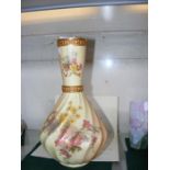 A Royal Worcester vase with hand painted floral de