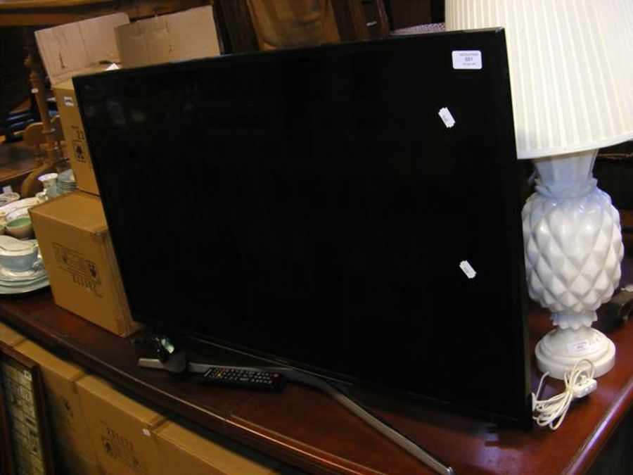 A Samsung 39 inch flatscreen TV complete with remo