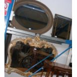 A shaped gilt wall mirror together with two others