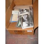 A box of military related postcards and ephemera