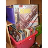 A collection of vinyl LP records, including Sgt. P