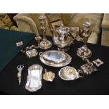 A selection of silver plated ware including candle