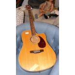 A Woods acoustic guitar with electric pick up