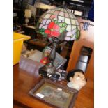A Tiffany style table lamp, plaster wall mask, tog