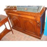A Victorian chiffonier with drawers and cupboards
