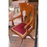 A walnut framed swivel office chair