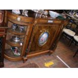 A Victorian walnut credenza having curved glass si