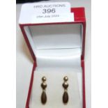 A pair of new 9ct gold drop earrings