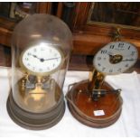 A Bulle Clock together with one other clock under