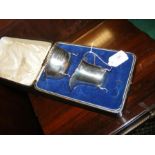 A cased presentation silver cream jug and bowl