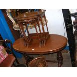 An oval Victorian stretcher table together with a