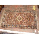 A small Middle Eastern rug with geometric border