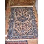 A Middle Eastern rug with geometric border - 150cm