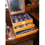 A jewellery box containing a large selection of mi