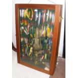 An unusual hanging display cabinet full of fishing