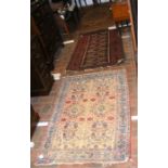 Three antique Middle Eastern rugs
