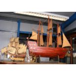 A large wooden model of three masted ship, togethe