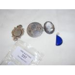 A silver brooch, medal, etc.