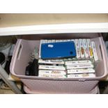 A Nintendo DS XL, together with a large collection