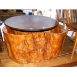 A tree trunk coffee table with replacement top