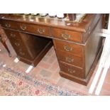 An oak pedestal desk