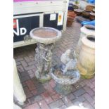 Two garden bird baths of varying shape and size