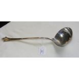 A heavy solid silver ladle - 34cms long