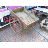 A vintage wooden and metal cart