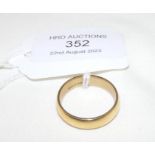 An 18ct gold wedding band