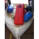 A fibreglass boat together with large boat fuel ta