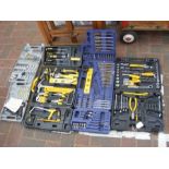 A quantity of drill bits, spanners and other tools