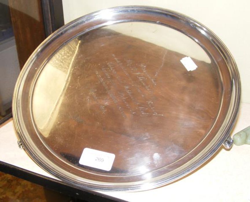 A circular silver waiters tray - 29cm diameter wit