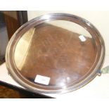 A circular silver waiters tray - 29cm diameter wit