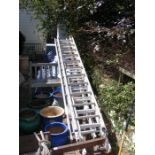 Assorted extending aluminium ladders