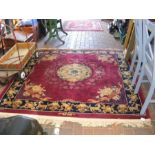 A decorative Chinese rug with maroon background an