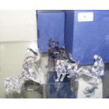 Four boxed Swarovski crystal ornaments - including