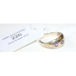 A 9ct gold ring with purple stone mount